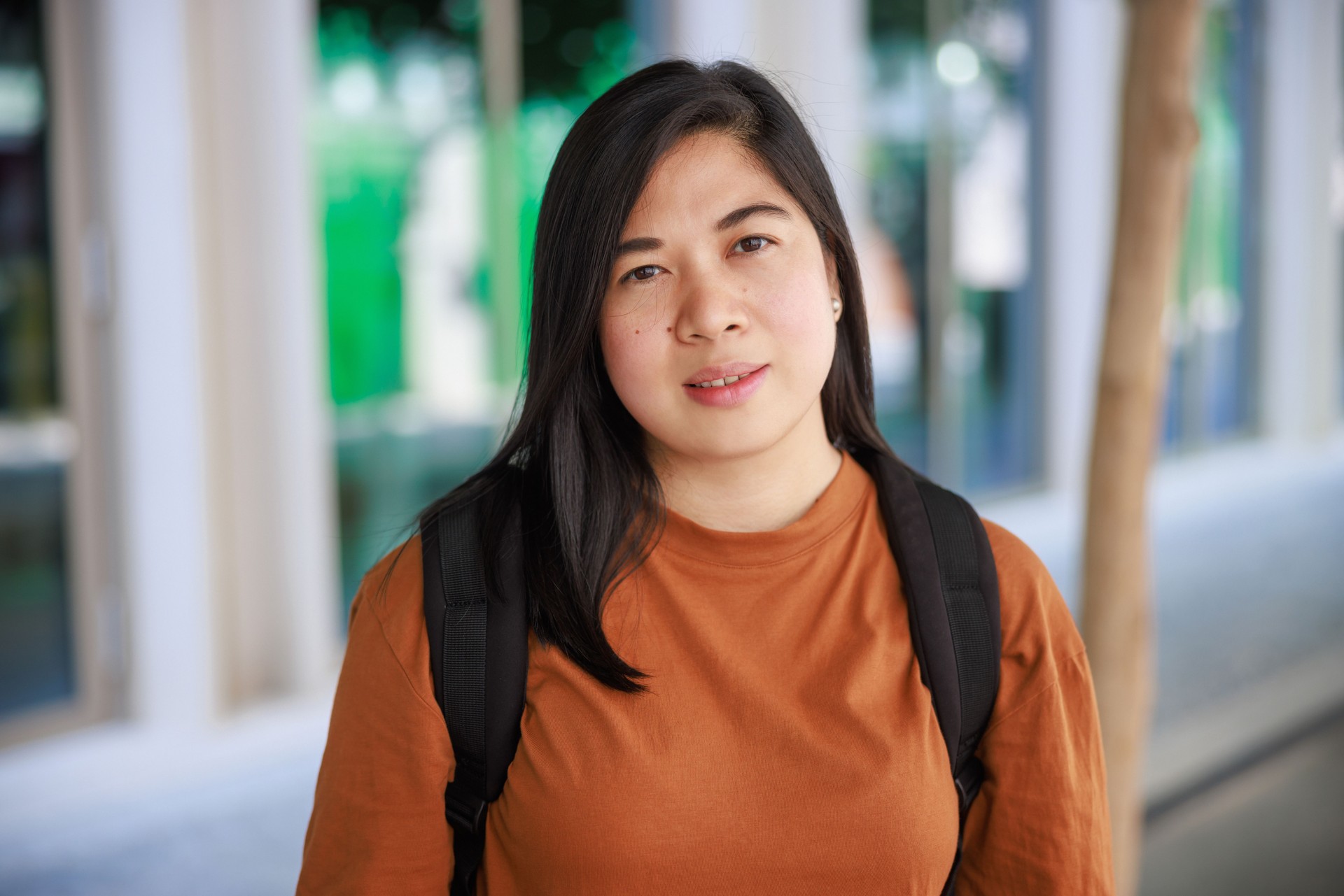 Beautiful Filipino woman looking at camera with serene look on her face